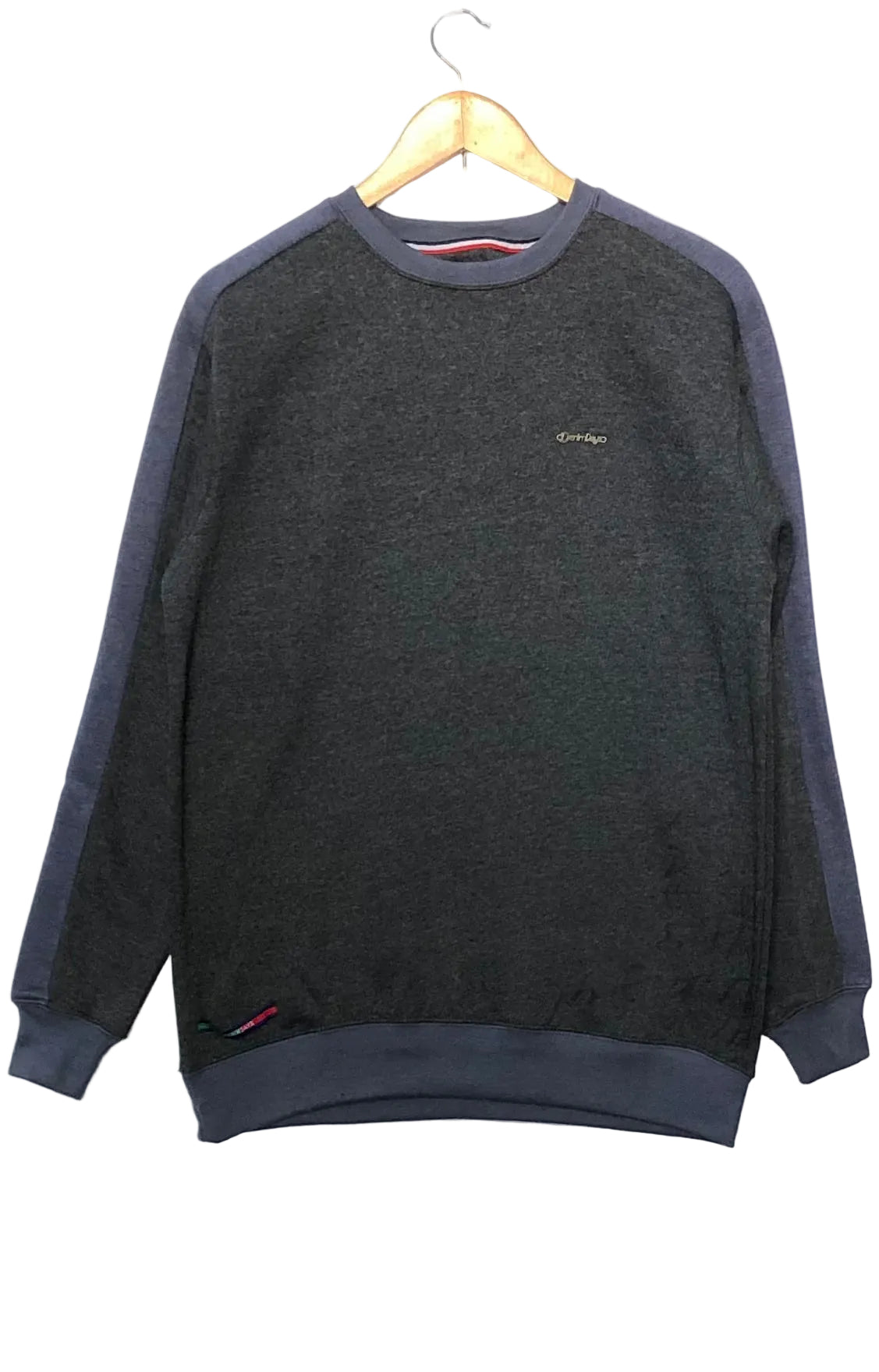 Charcoal gray sweatshirt with navy sleeves on a hanger against a white background
