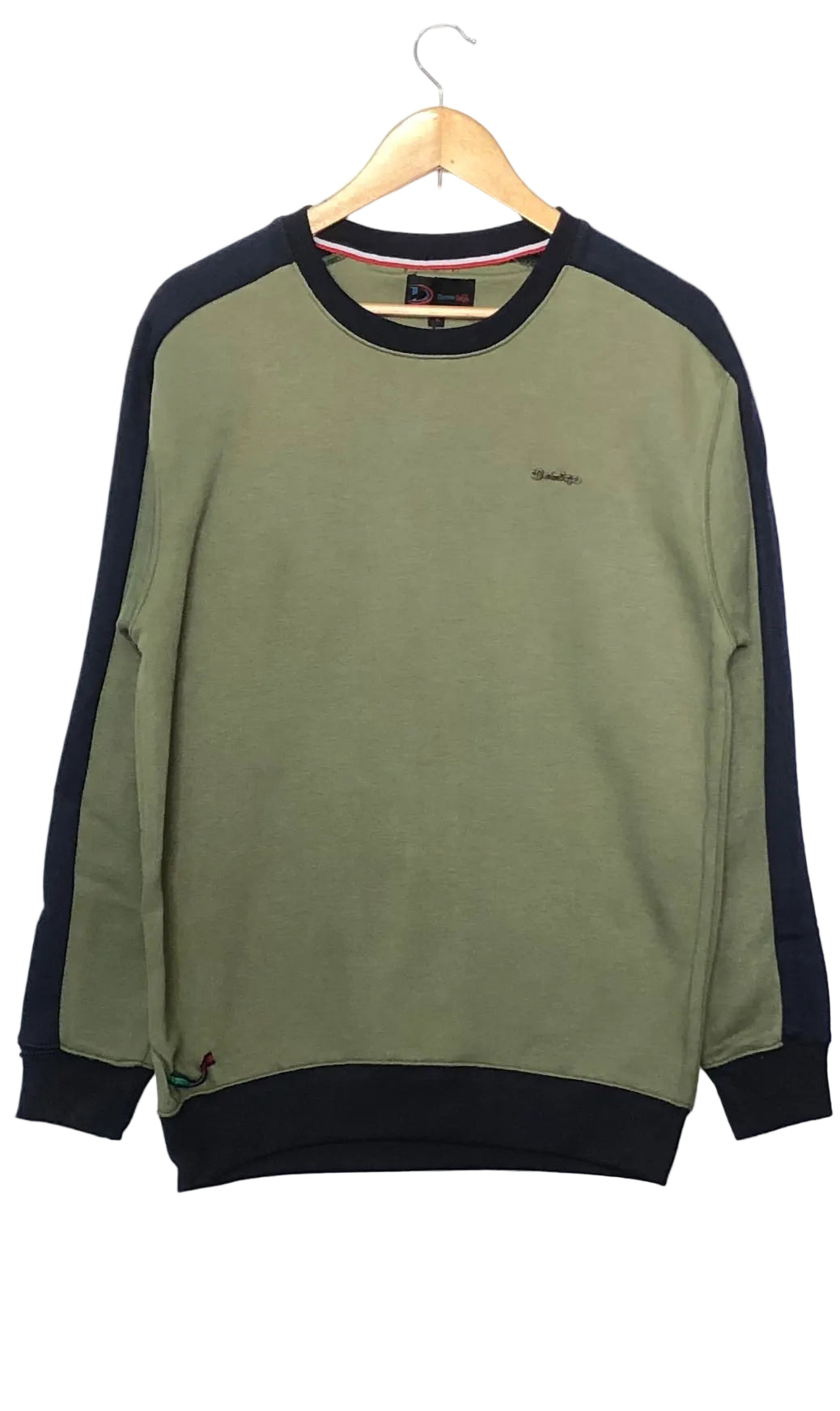 Green sweatshirt with black sleeves and collar on a hanger against a white background