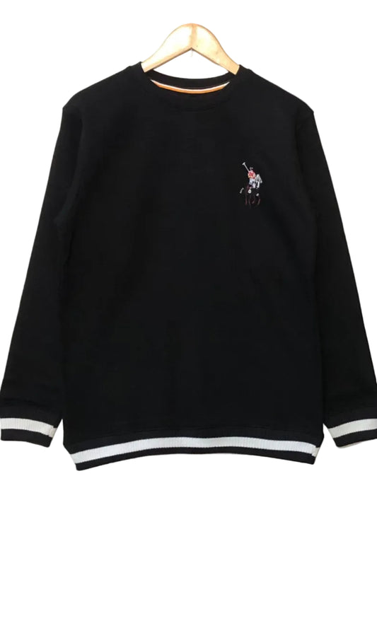 Black sweatshirt with a logo on a hanger against a white wall