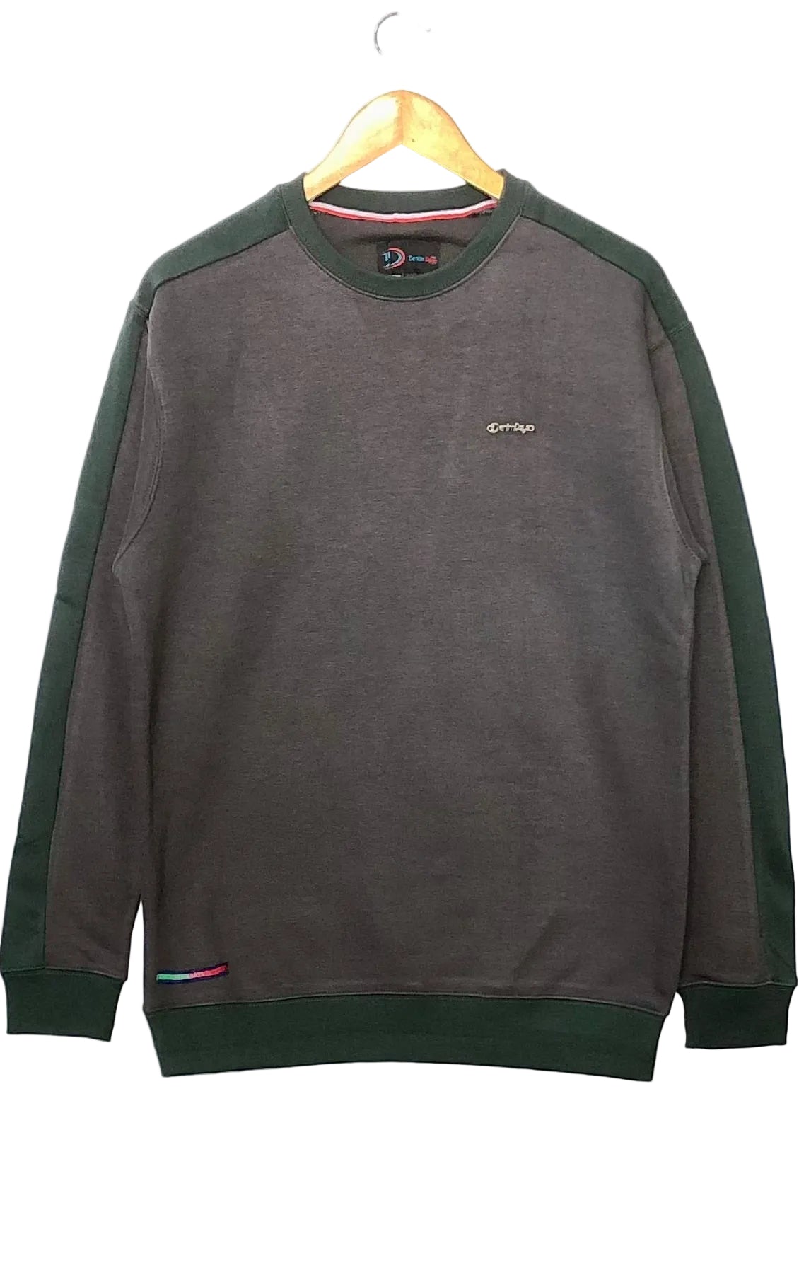 Gray sweatshirt with green sleeves on a hanger against a white background